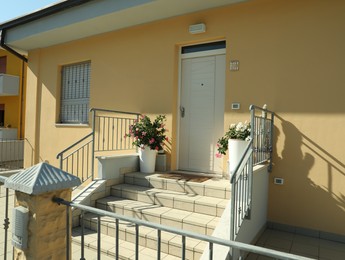 Entrance of beautiful residential building on sunny day