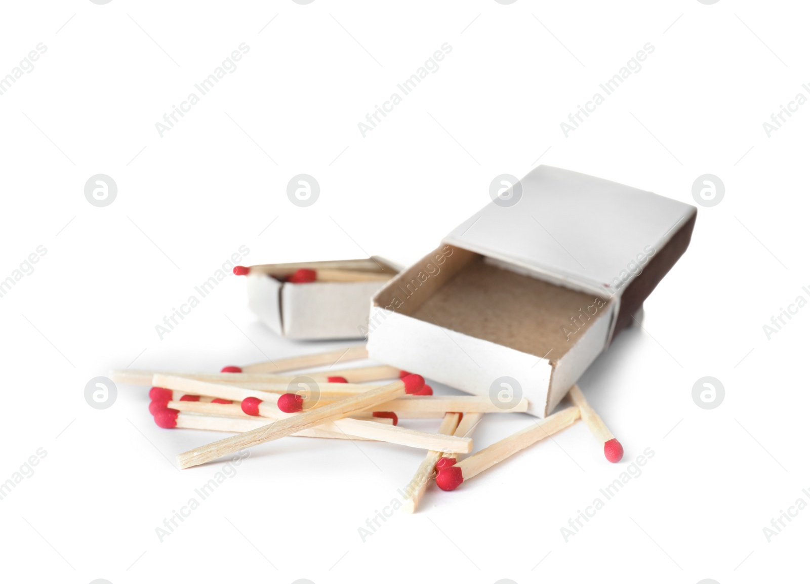 Photo of Cardboard boxes and matches on white background