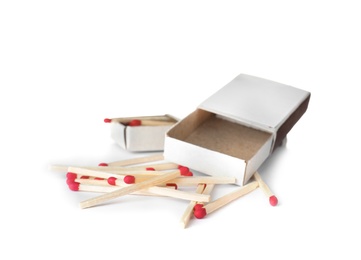 Photo of Cardboard boxes and matches on white background