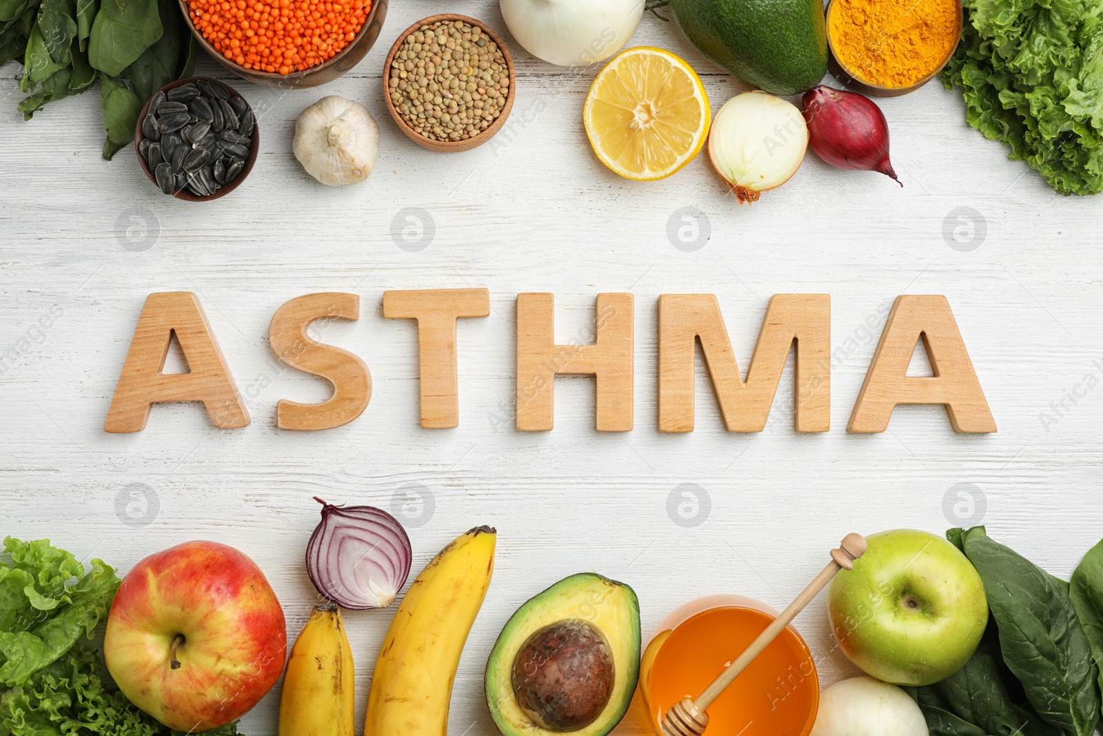 Photo of Flat lay composition with natural products as home remedies and word ASTHMA on wooden background
