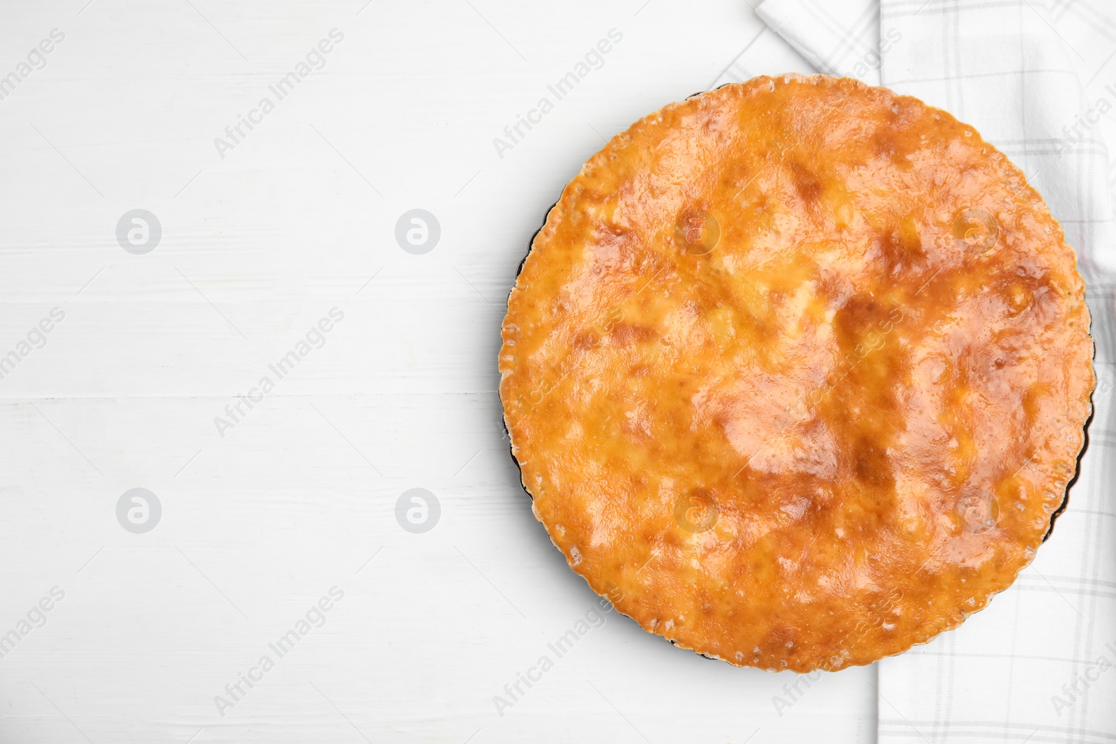 Photo of Delicious pie with meat on white wooden table, flat lay. Space for text