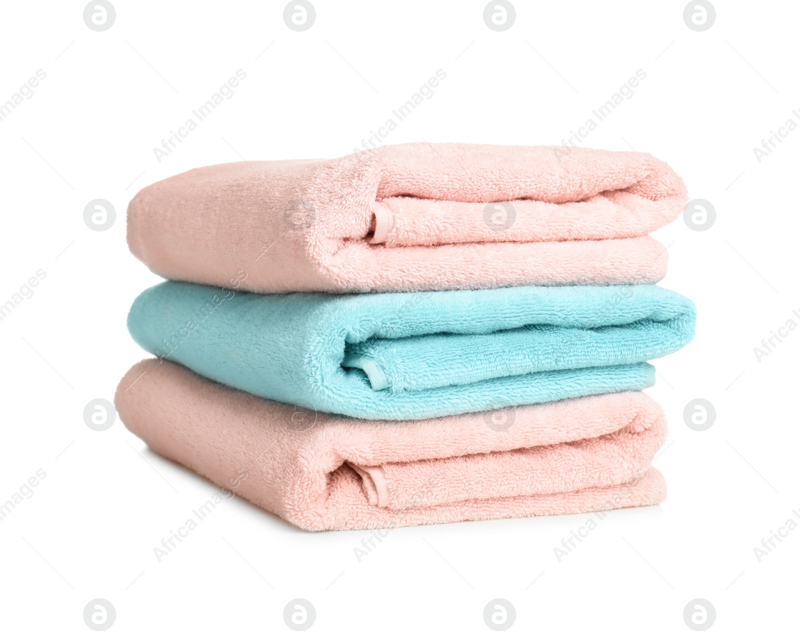 Photo of Folded soft terry towels on white background