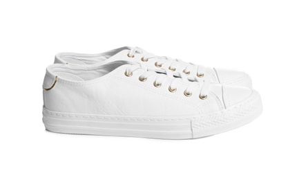 Pair of stylish sneakers on white background