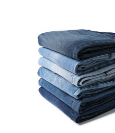 Image of Stacks of different folded jeans isolated on white