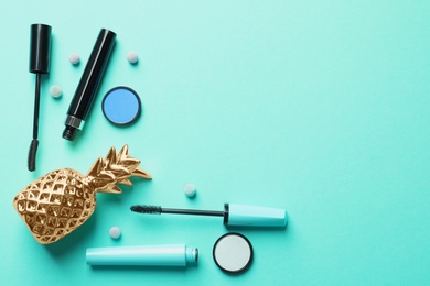Photo of Flat lay composition with decorative cosmetics on color background