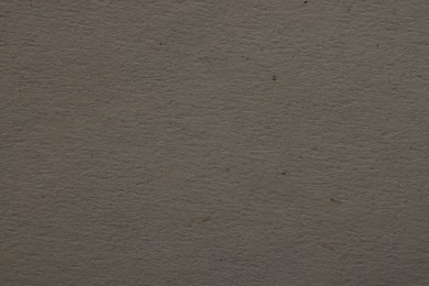 Photo of Texture of grey paper sheet as background, top view