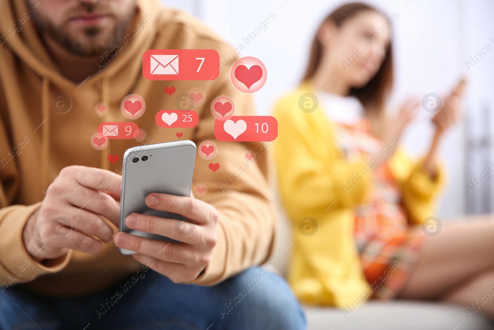 Image of Young man using smartphone at home, closeup. Social media