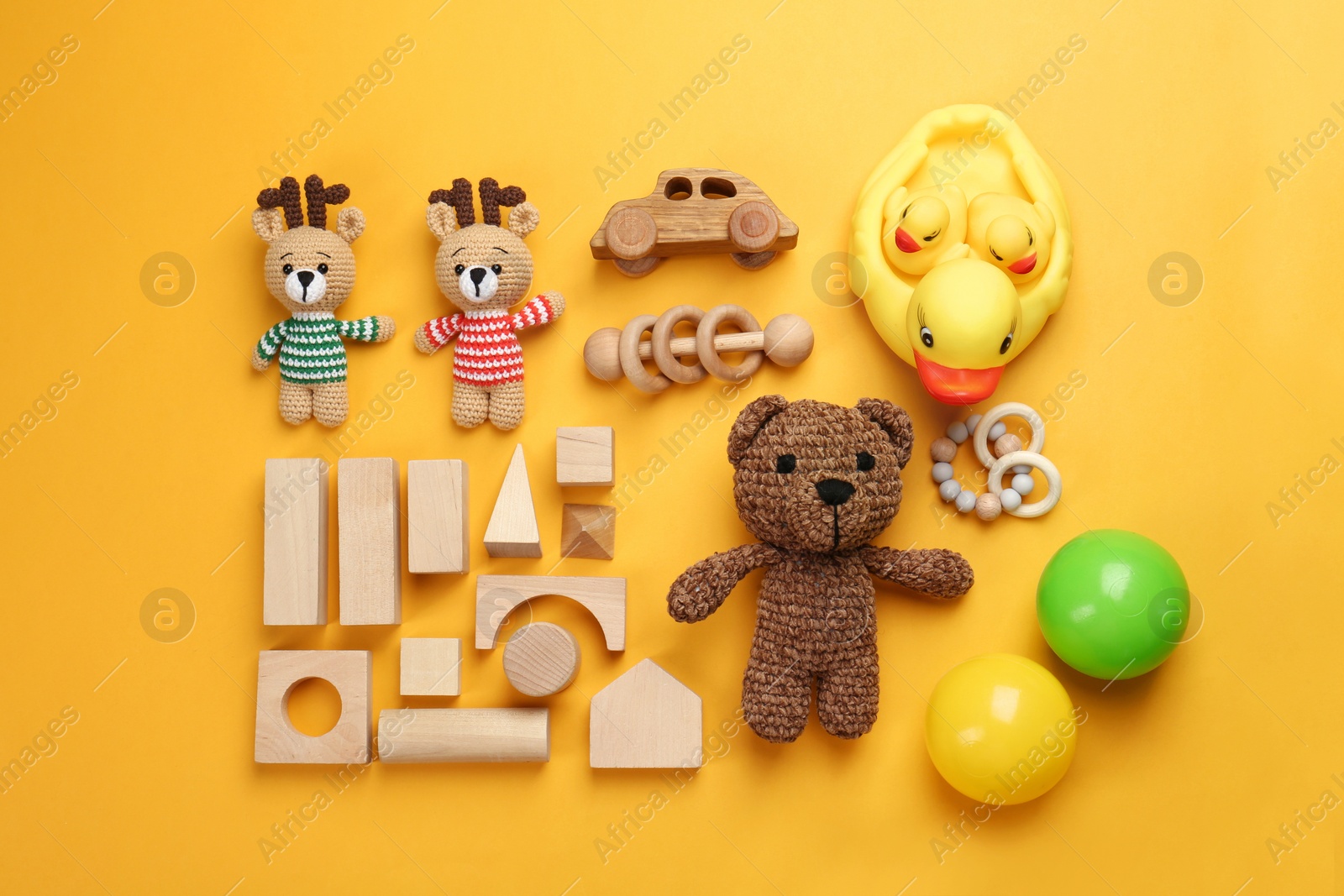 Photo of Different children's toys on yellow background, flat lay