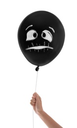 Woman holding spooky balloon for Halloween party on white background, closeup