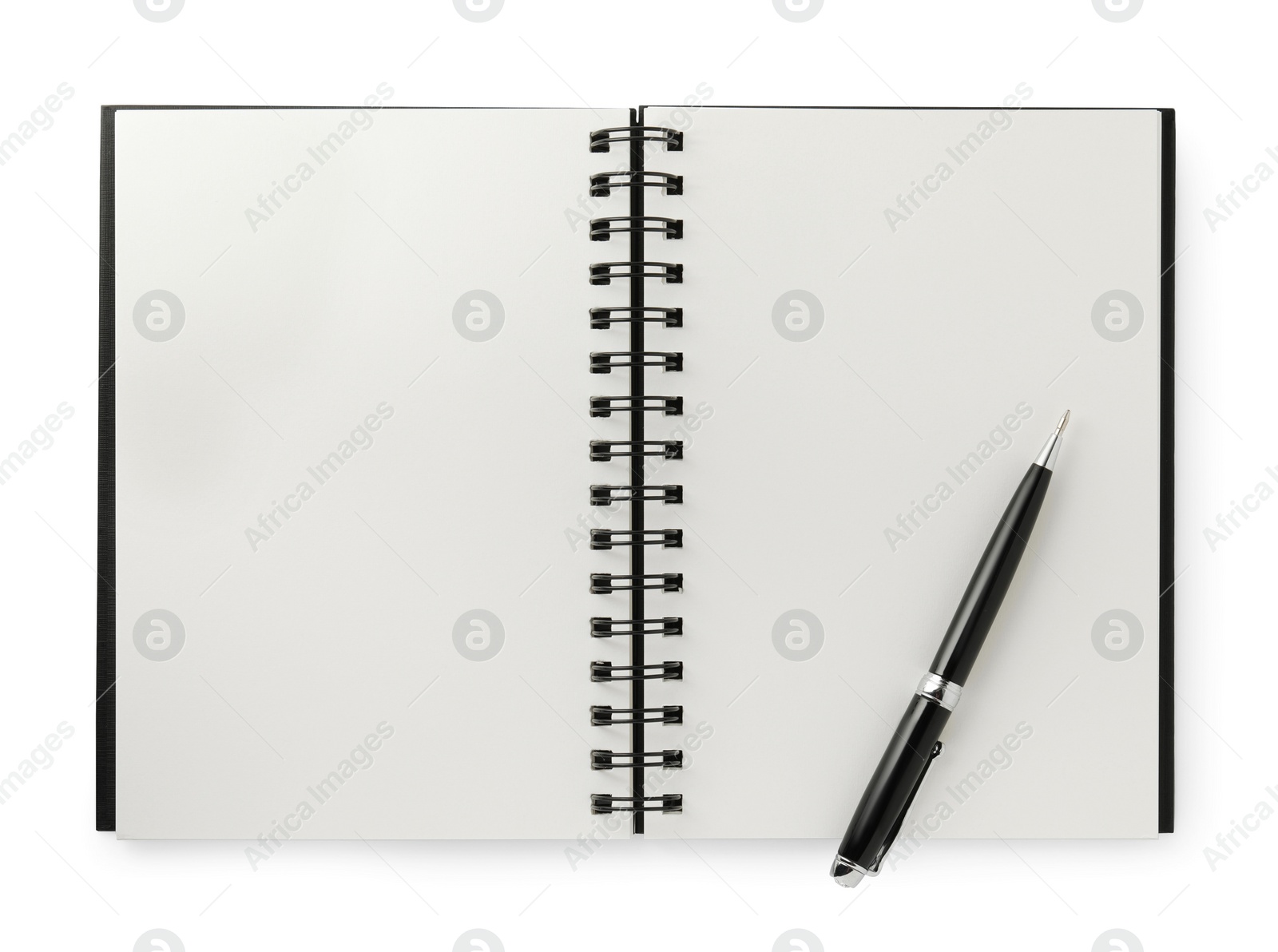 Photo of Open blank notebook with pen isolated on white, top view