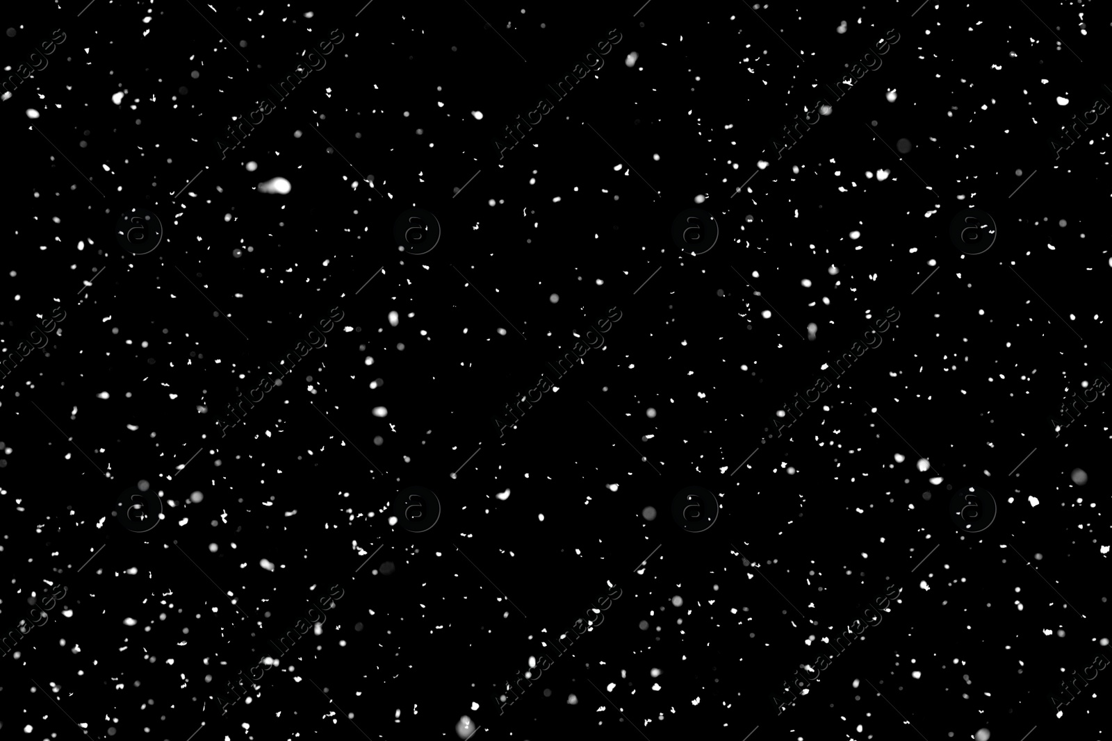 Photo of White snow falling down on black background