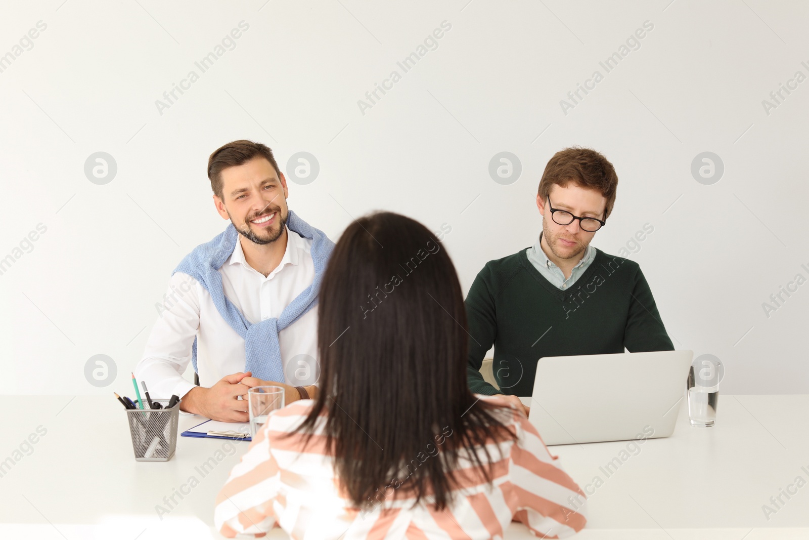 Photo of Human resources commission conducting job interview with applicant in office