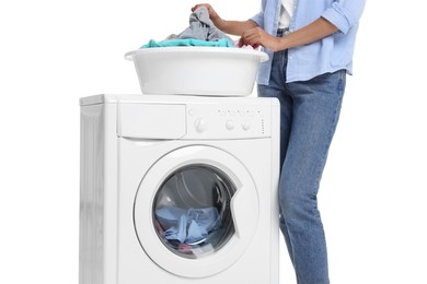 Photo of Woman with laundry basket and washing machine on white background, closeup