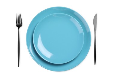 Photo of Plates and cutlery on white background, top view