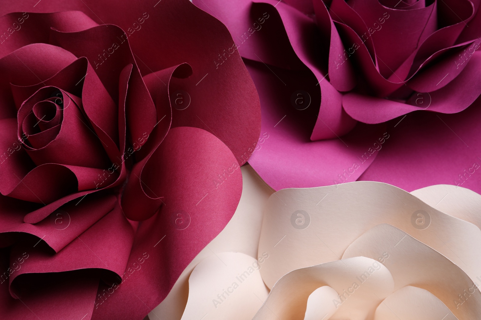 Photo of Different beautiful flowers made of paper as background, top view