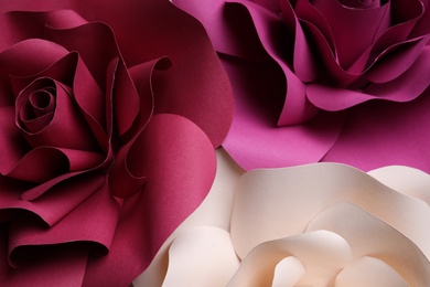 Different beautiful flowers made of paper as background, top view