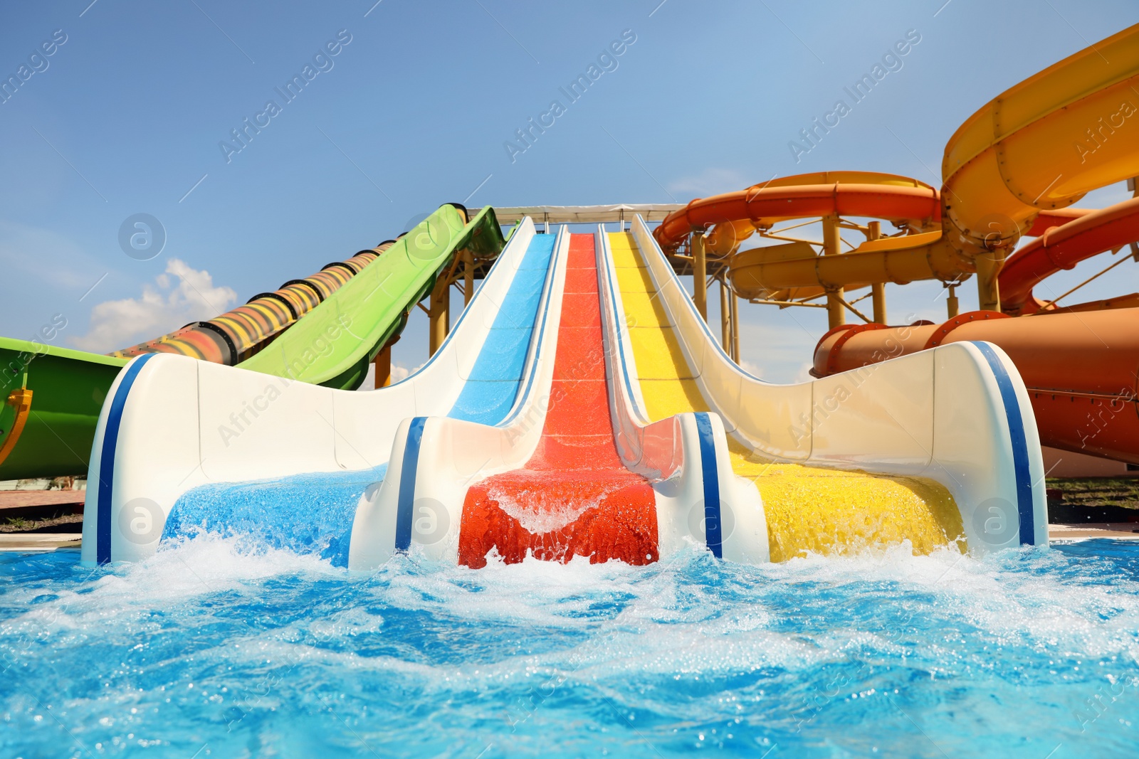 Photo of Colorful slides in water park. Summer vacation