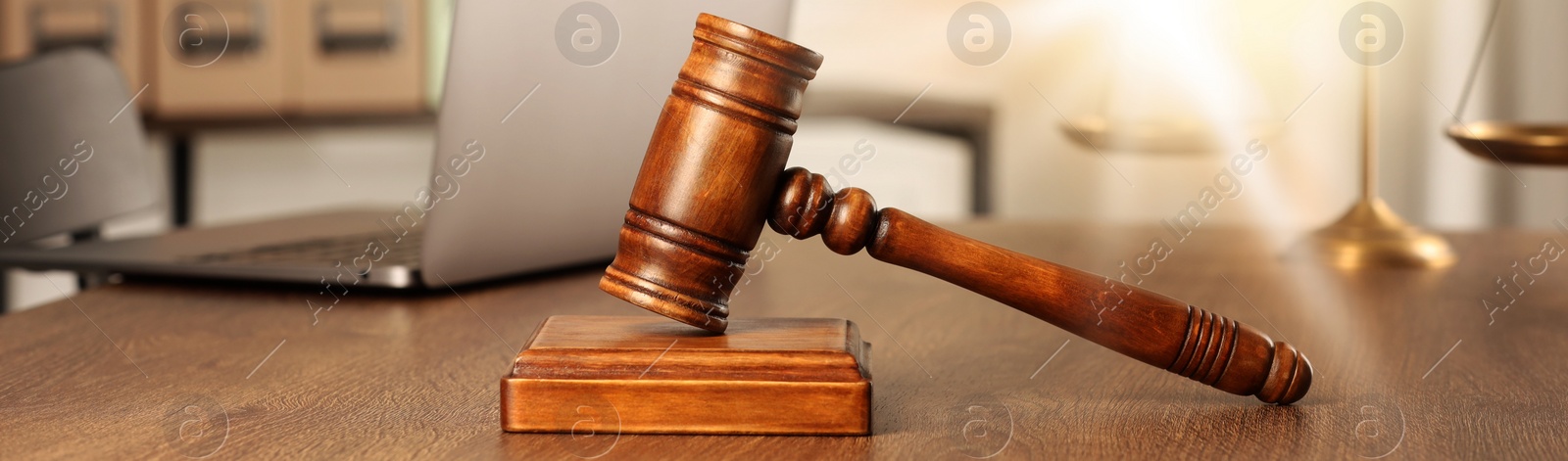 Image of Law concept. Gavel and sound block on wooden table, banner design