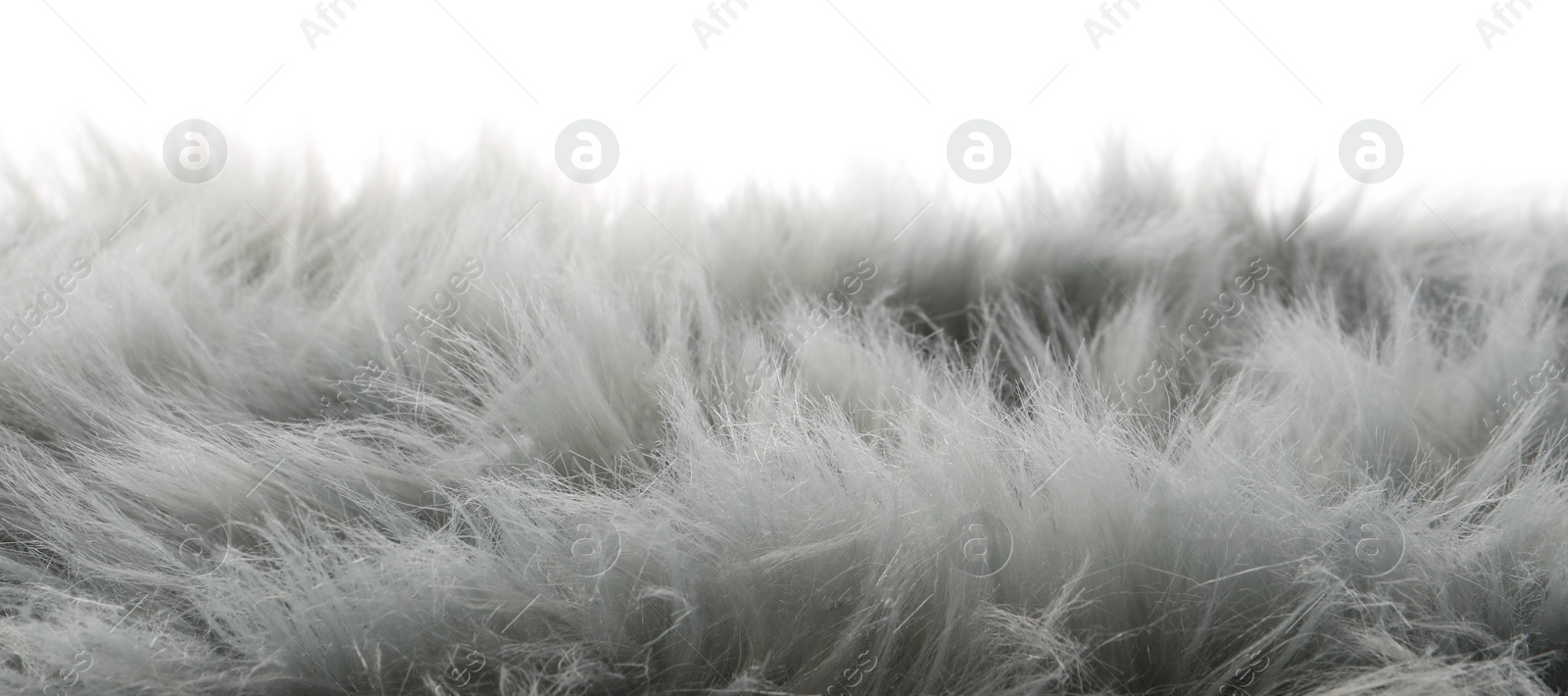 Photo of Soft grey faux fur isolated on white