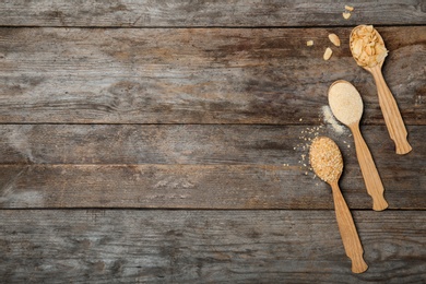 Photo of Flat lay composition with dried garlic products on wooden background