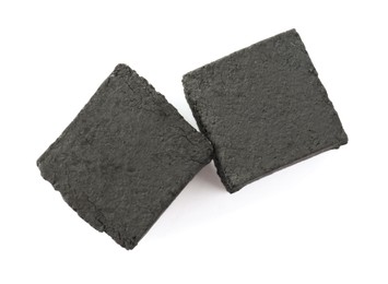 Photo of Charcoal cubes for hookah on white background, top view