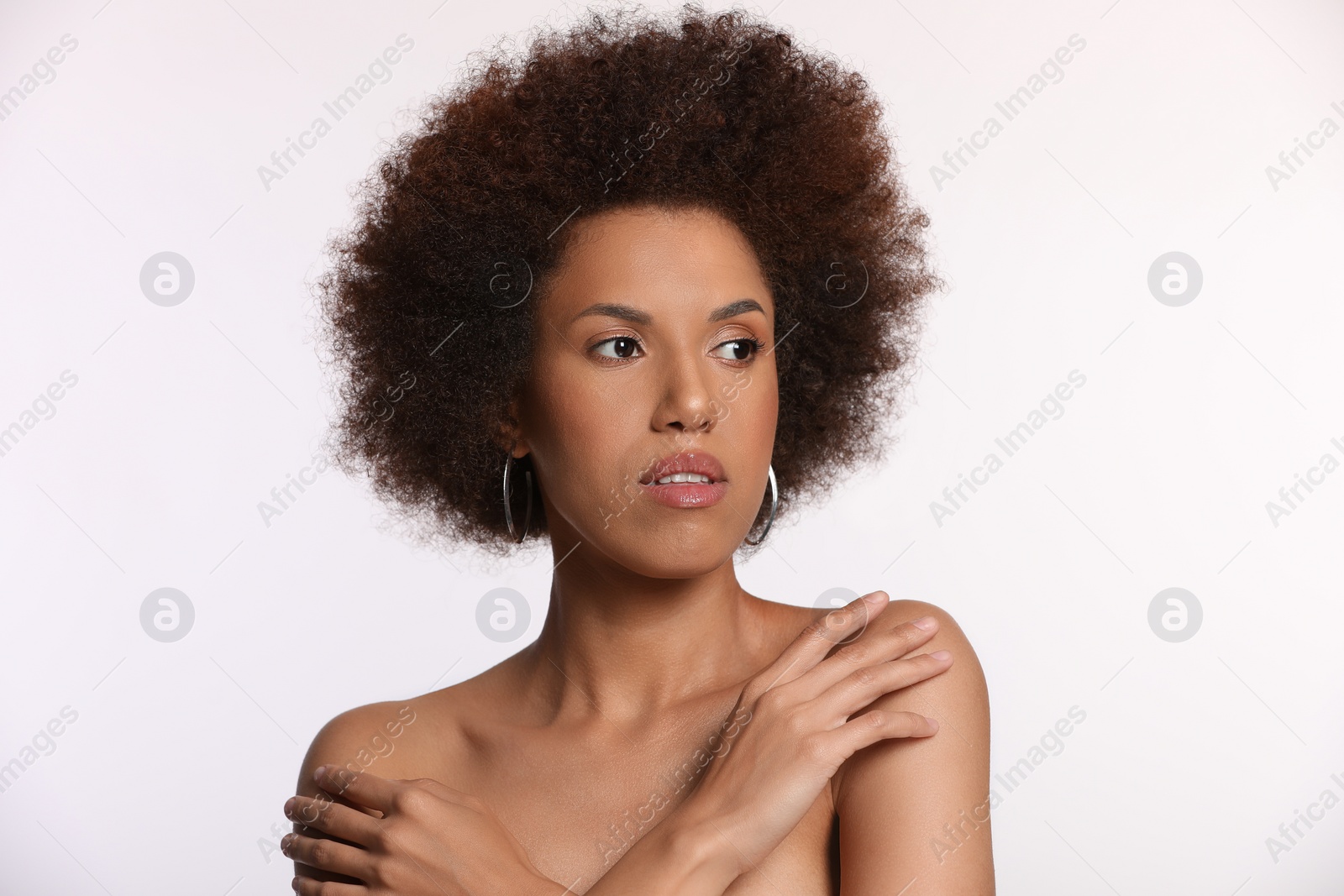 Photo of Portrait of beautiful young woman with glamorous makeup on white background