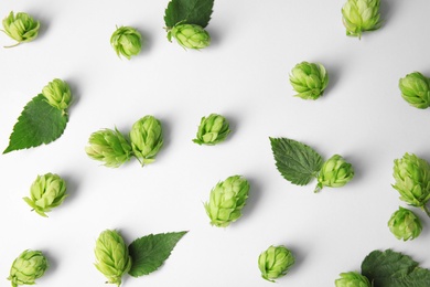 Photo of Fresh green hops on white background, top view. Beer production