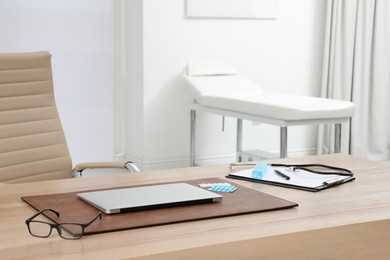 Photo of Modern doctor's workplace in office. Interior design