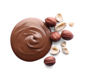 Photo of Delicious chocolate paste with hazelnuts on white background, top view