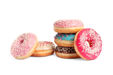 Delicious glazed doughnuts with sprinkles on white background