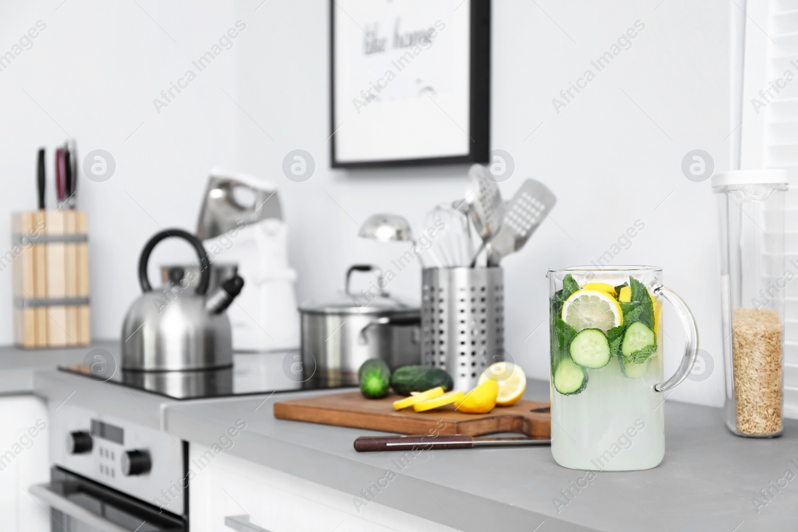 Photo of Modern kitchen interior with new furniture and different utensils