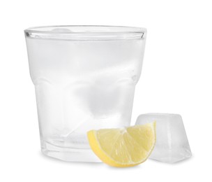 Glass of vodka, ice and lemon isolated on white