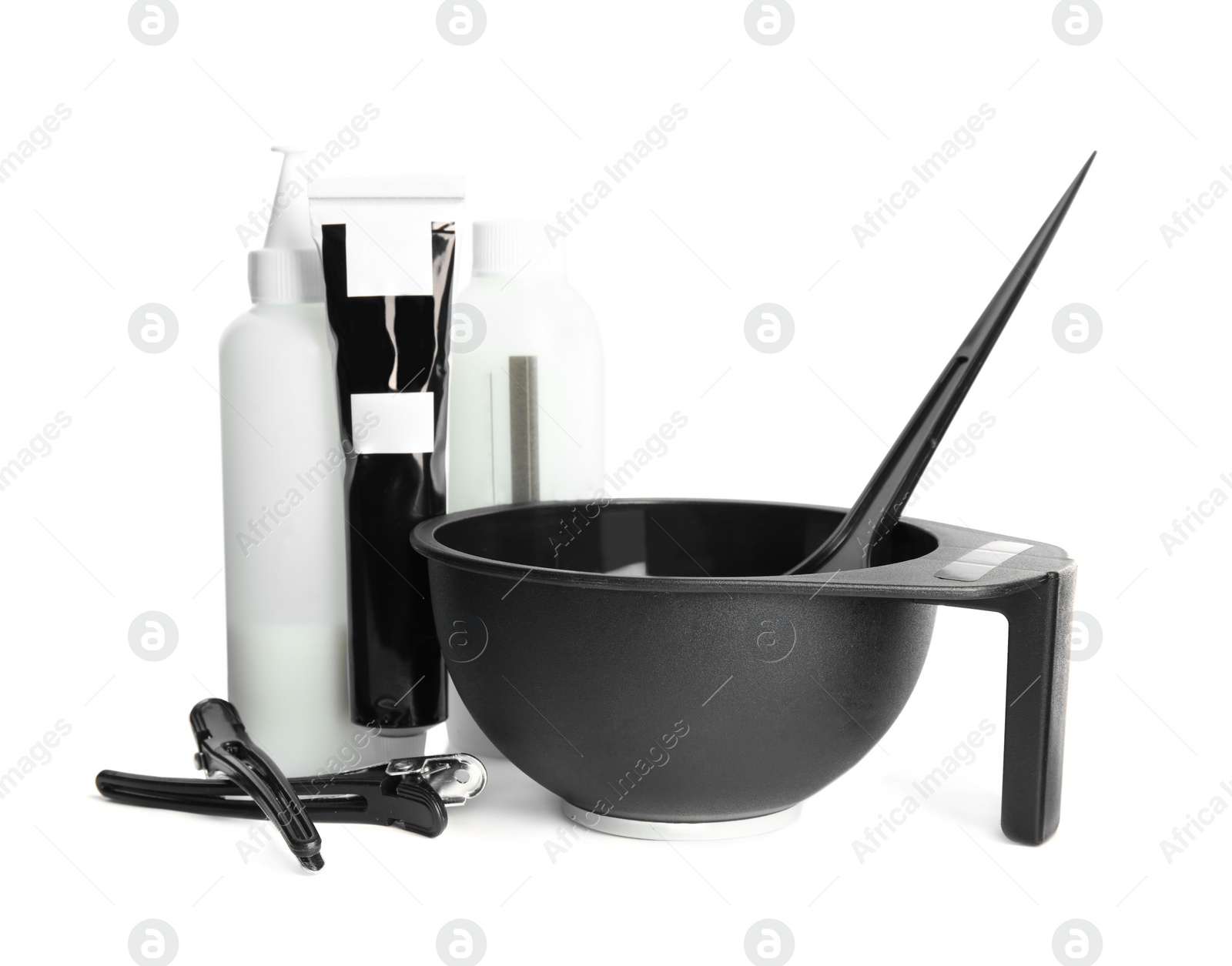 Photo of Professional tools for hair dyeing on white background