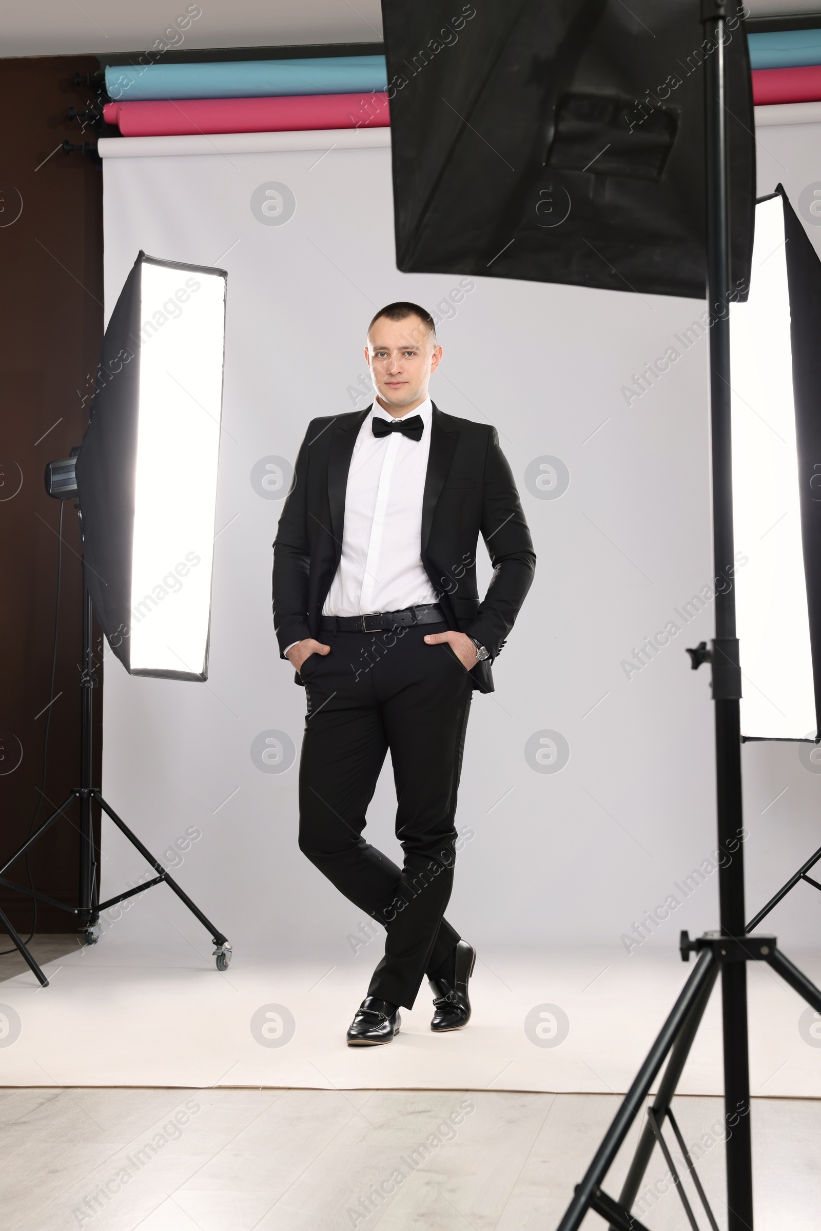 Photo of Handsome model posing in studio. Professional photo session