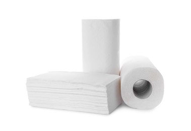 Photo of Rolls and stack of paper towels isolated on white