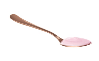 Spoon with creamy yogurt on white background