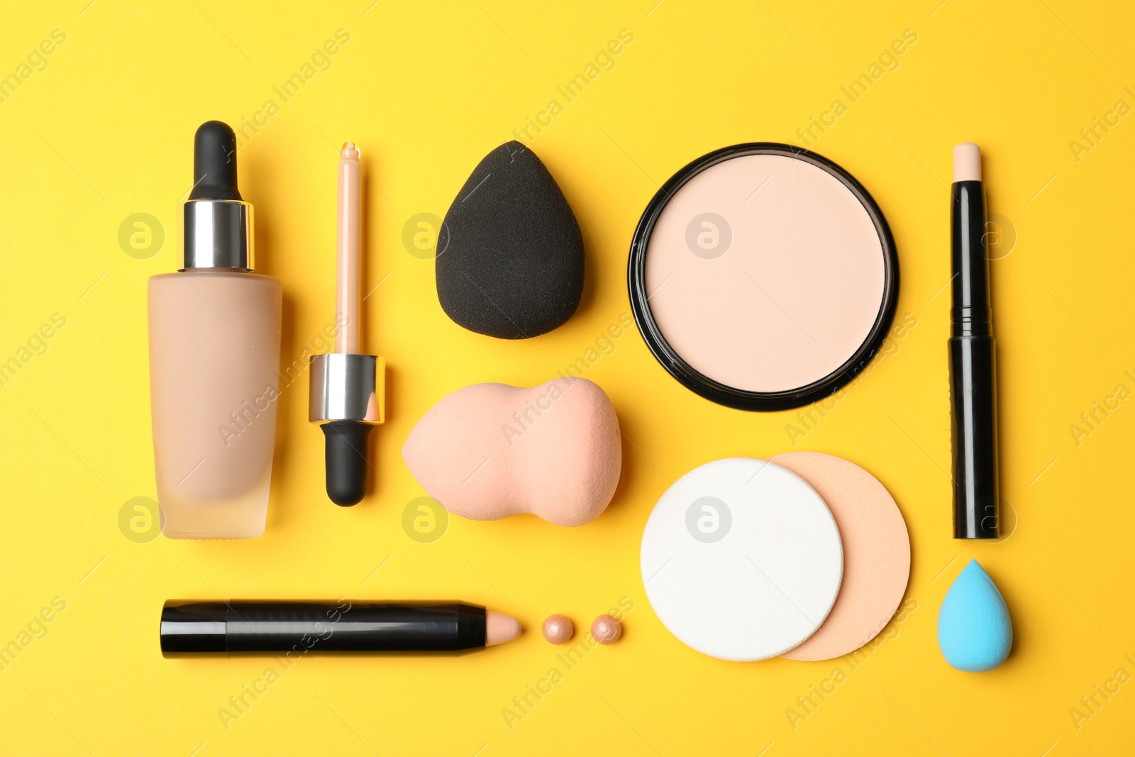 Photo of Flat lay composition with skin foundation, powder and beauty accessories on color background