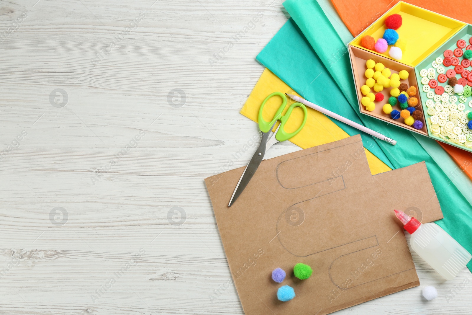 Photo of Materials and tools on white wooden table, flat lay with space for text. Cactus pinata DIY