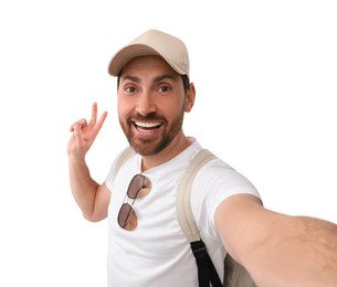Photo of Smiling man taking selfie and showing peace sign on white background