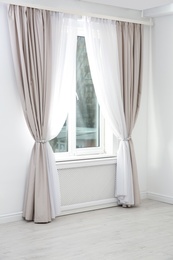 Modern window with curtains in room. Home interior