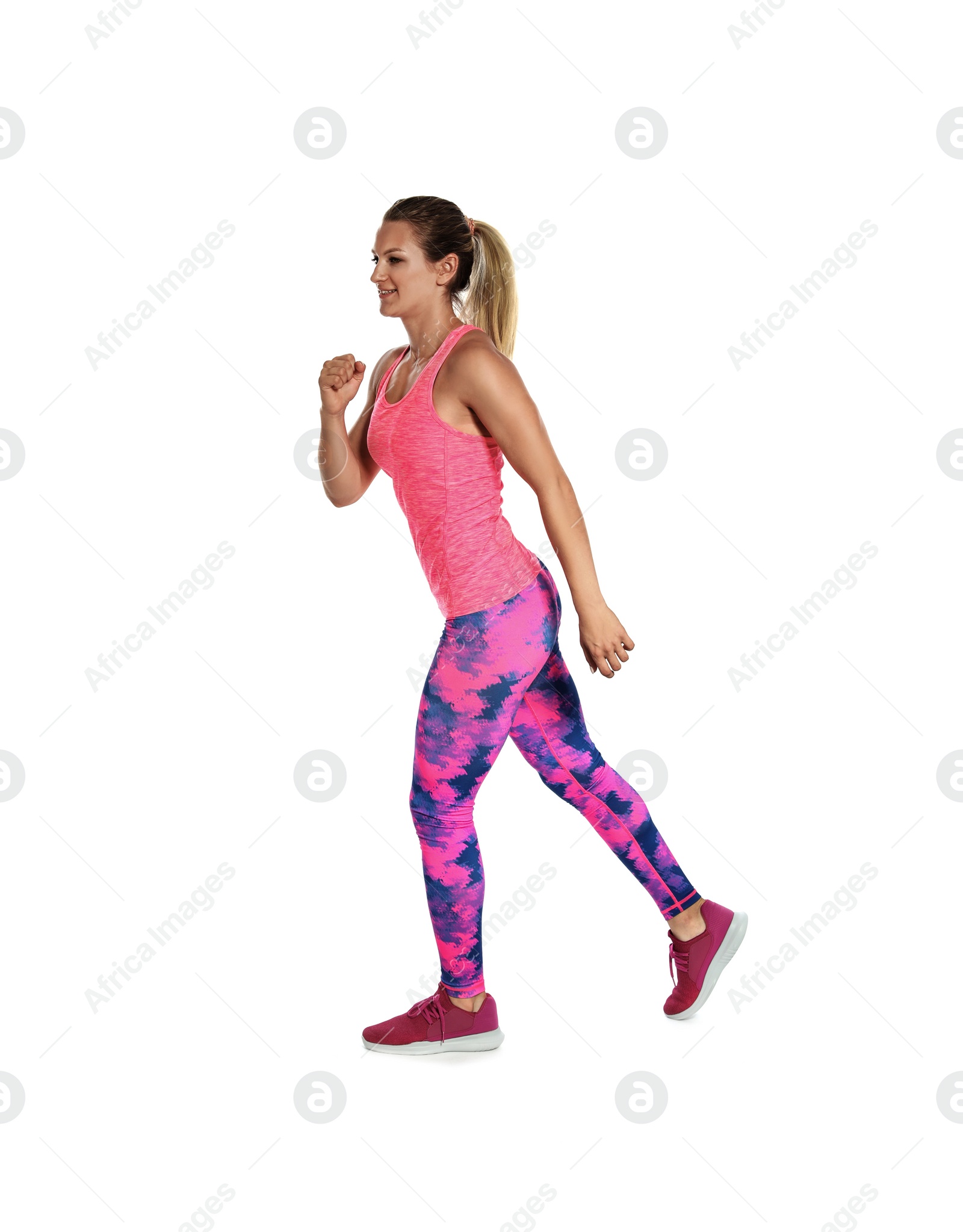 Photo of Sporty young woman running on white background