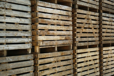 Photo of Pile of empty wooden crates outdoors on sunny day