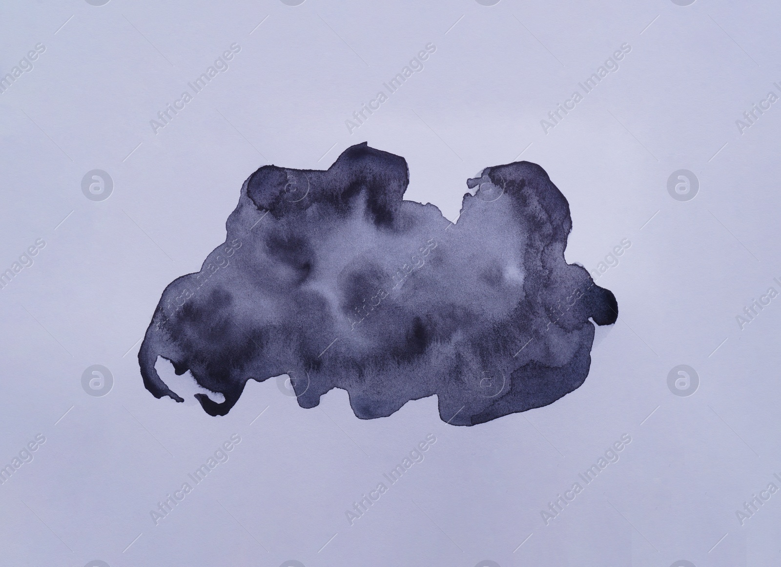 Photo of Black watercolor blots on white background, top view