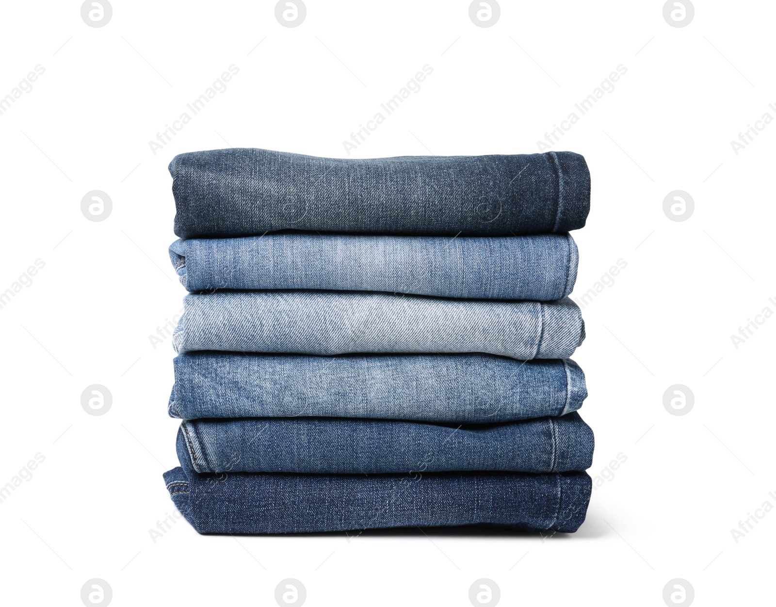 Image of Stack of different folded jeans isolated on white