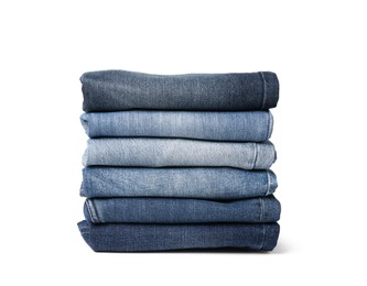 Image of Stack of different folded jeans isolated on white