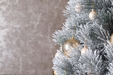 Photo of Beautiful Christmas tree with festive decor on brown background. Space for text