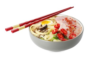 Delicious ramen in bowl and chopsticks isolated on white. Noodle soup