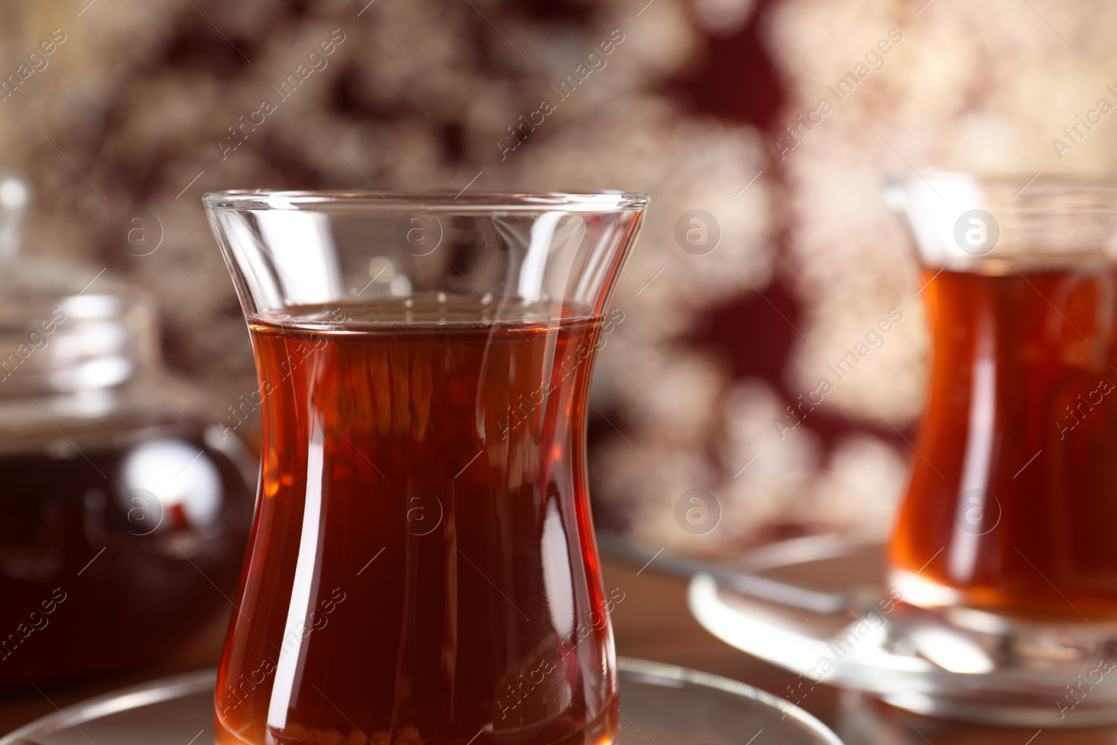 Photo of Traditional Turkish tea in glasses on table, closeup. Space for text