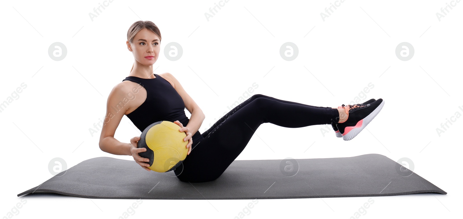 Photo of Athletic woman doing exercise with medicine ball isolated on white