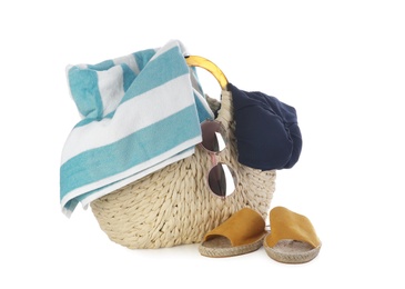 Photo of Bag with beach accessories on white background